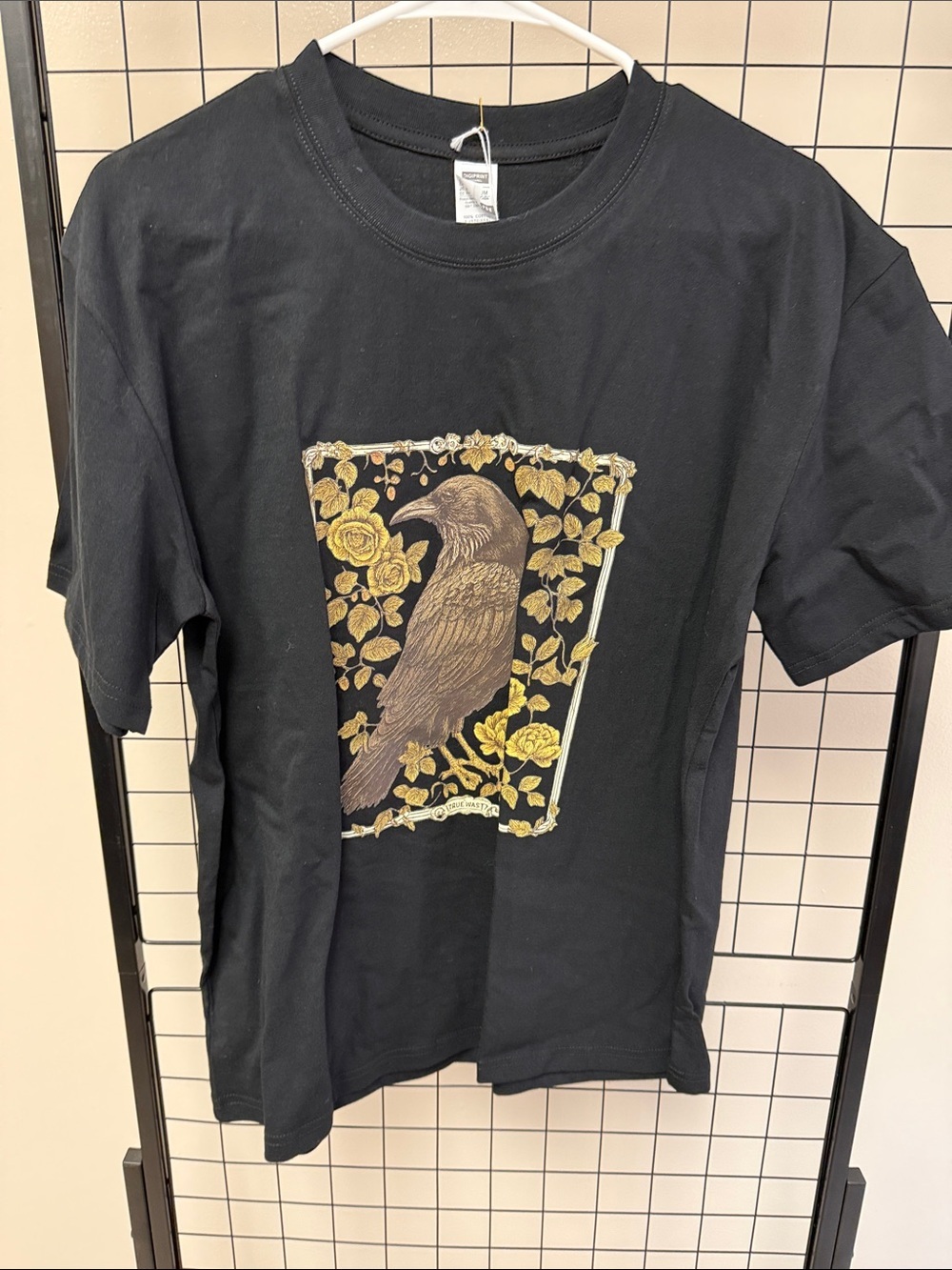 Black Bird Graphic T‑Shirt with Gold Floral Print